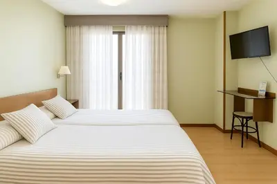 Cama o camas de una habitación en Hostal Concejo