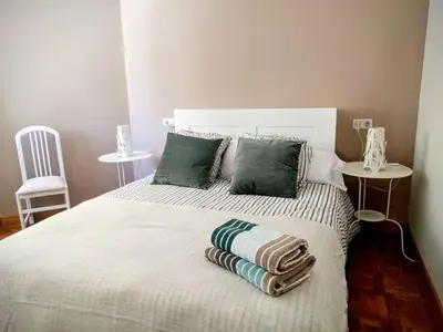 Cama o camas de una habitación en A pocos minutos del centro con PARKING GRATIS en el edificio Nº REGISTRO Vu-74