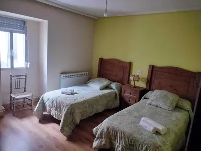 Cama o camas de una habitación en Casa de pueblo