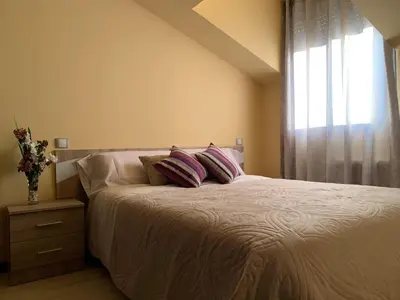 Cama o camas de una habitación en Apartamentos El Retiro de Avellaneda by RetiroRural