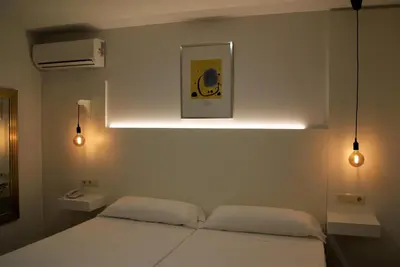 Cama o camas de una habitación en Hotel La Encomienda