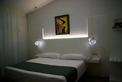 Cama o camas de una habitación en Hotel La Encomienda