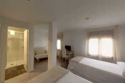 Cama o camas de una habitación en El Mirador de Candelario