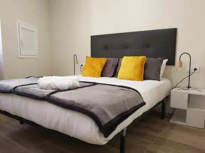 Cama o camas de una habitación en KubiK APARTAMENTOS K1