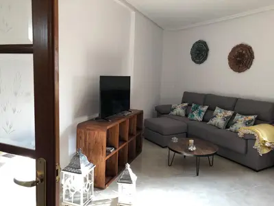 Una televisión o centro de entretenimiento en Apartamento SC Victoria