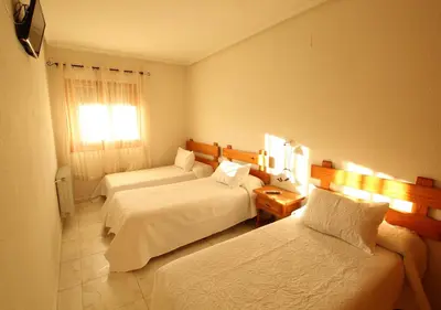 Cama o camas de una habitación en Hostal Sierra de Gredos