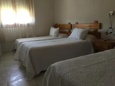 Cama o camas de una habitación en Hostal Sierra de Gredos