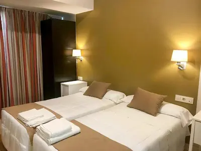 Cama o camas de una habitación en Hotel Moya