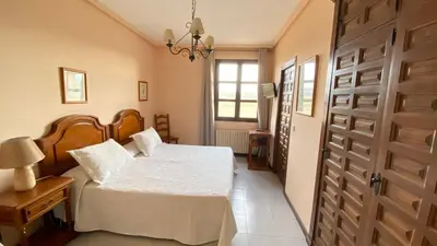 Cama o camas de una habitación en Hostal Las Paneras