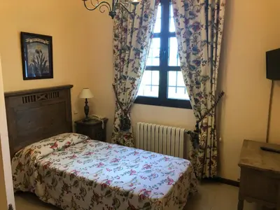 Cama o camas de una habitación en Hostal Las Paneras