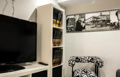 Una televisión o centro de entretenimiento en Apartamento La Campanina
