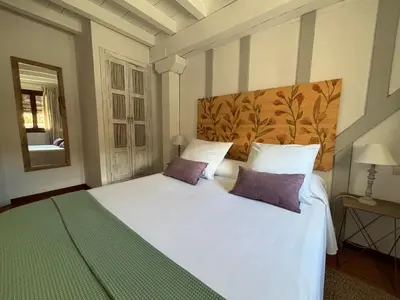 Cama o camas de una habitación en Alborada Apartamentos Rurales
