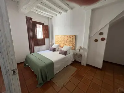 Cama o camas de una habitación en Alborada Apartamentos Rurales