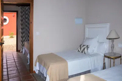 Cama o camas de una habitación en Hotel Rural Las Tejuelas