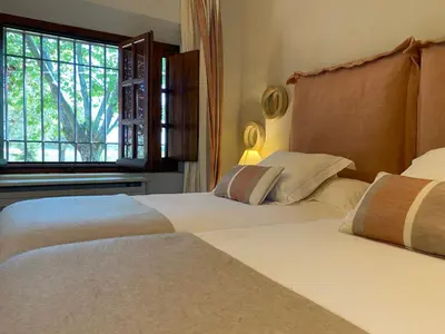 Cama o camas de una habitación en Hotel Rural Las Tejuelas