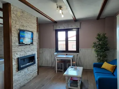 Una televisión o centro de entretenimiento en Apartamento Rural Amaluna