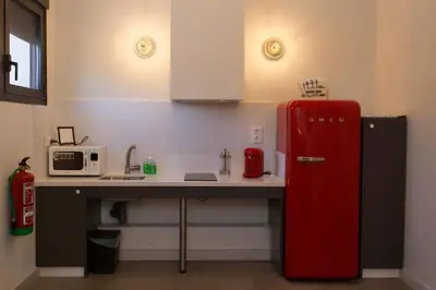 Una cocina o zona de cocina en TRIA NOMINA Apartamentos Turísticos