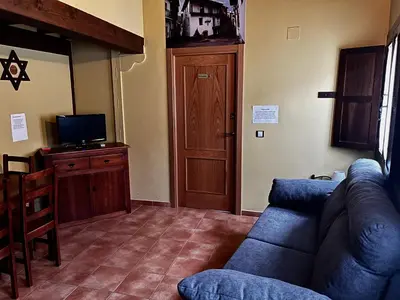 Una televisión o centro de entretenimiento en La Estrella de David, Apartamentos Rurales