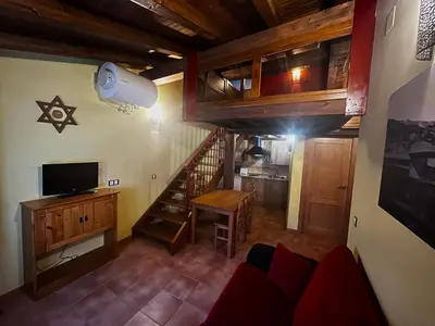 Una televisión o centro de entretenimiento en La Estrella de David, Apartamentos Rurales