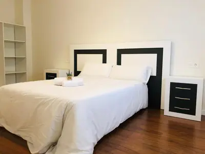 Cama o camas de una habitación en Apartamento turísticos Puente Romano P1 1-C