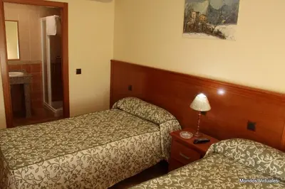 Cama o camas de una habitación en Nuevo Hostal Paulino
