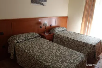 Cama o camas de una habitación en Nuevo Hostal Paulino