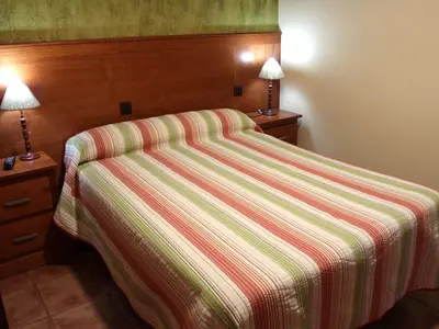 Cama o camas de una habitación en Nuevo Hostal Paulino