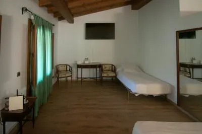 Cama o camas de una habitación en Hospedium Hotel Rural Abadía de Yuste