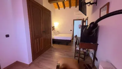Cama o camas de una habitación en Hospedium Hotel Rural Abadía de Yuste