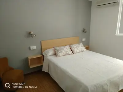 Cama o camas de una habitación en ADEREZO Hostal Restaurante
