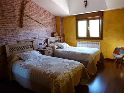Cama o camas de una habitación en Casa Rural & SPA Mirador Sierra de Béjar
