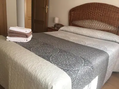Cama o camas de una habitación en VUT sencilla y cómoda en Ávila capital.