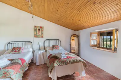 Cama o camas de una habitación en La Jara · Apartamentos Rurales