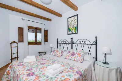 Cama o camas de una habitación en La Jara · Apartamentos Rurales