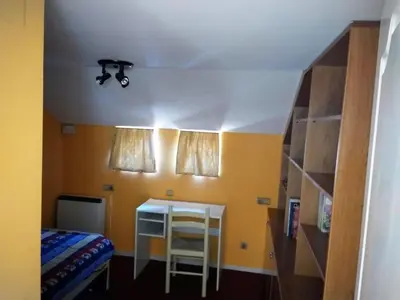 Cama o camas de una habitación en EL TRASTERO