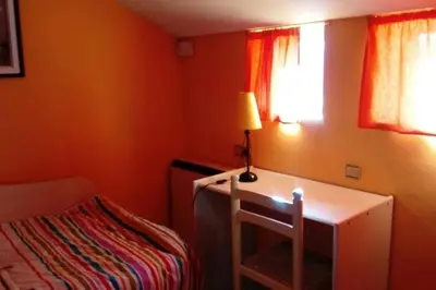 Cama o camas de una habitación en EL TRASTERO