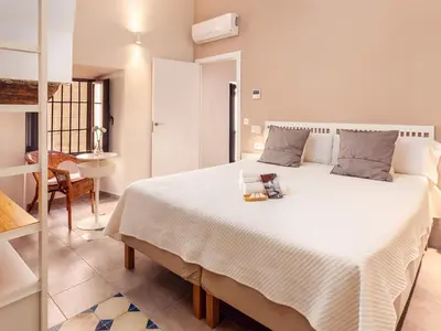 Cama o camas de una habitación en Apartamentos Plaza Mayor 35