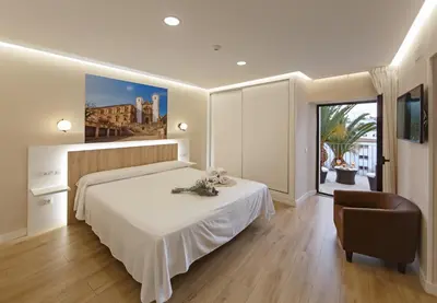 Cama o camas de una habitación en Cáceres Deluxe