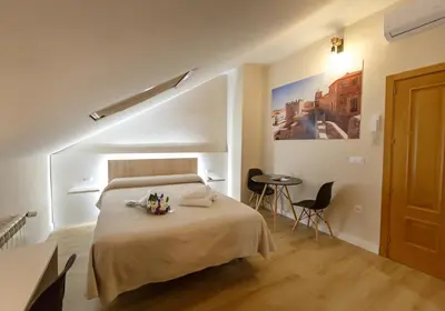 Cama o camas de una habitación en Cáceres Deluxe