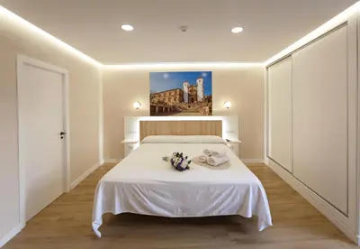 Cama o camas de una habitación en Cáceres Deluxe