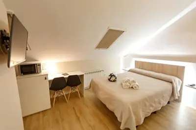 Cama o camas de una habitación en Cáceres Deluxe