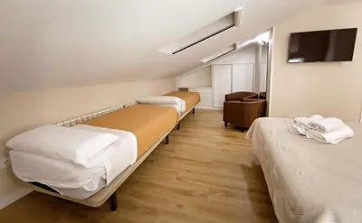 Cama o camas de una habitación en Cáceres Deluxe