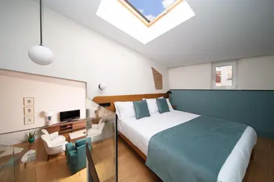 Cama o camas de una habitación en Apartamentos Habitavit en Cáceres