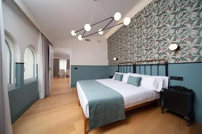 Cama o camas de una habitación en Apartamentos Habitavit en Cáceres
