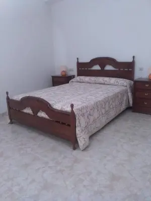 Cama o camas de una habitación en casa familiar La Lunara
