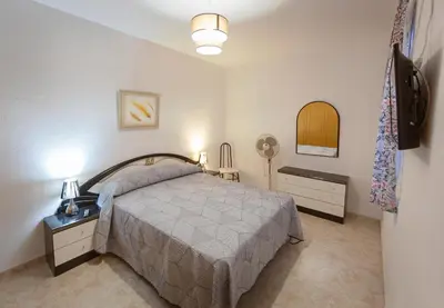Cama o camas de una habitación en casa familiar La Lunara