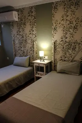Cama o camas de una habitación en La Berruca Casa Rural Malpartida de Cáceres