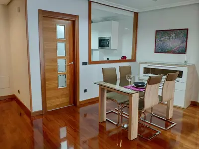 Una televisión o centro de entretenimiento en Apartamento Edificio Plaza Gran Vía