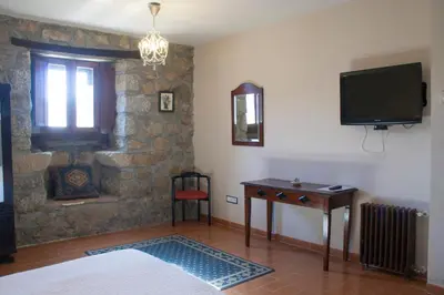 Una televisión o centro de entretenimiento en Posada Palacio Manjabalago