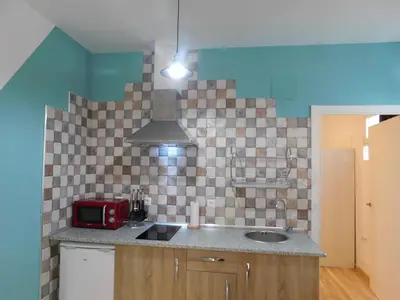 Una cocina o zona de cocina en APARTAMENTO ROMULO Y REMO-ROMULO
